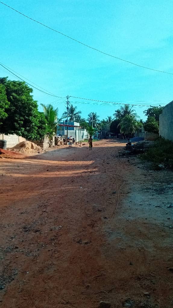 Demi lot de terrain en vente à Agoe Sogbossito non loin du bar Izi – 15 000 000 FCFA