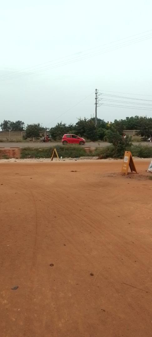 Terrain d'un demi lot en vente à Agoé Sogbossito à 100 m du goudron – 15 millions FCFA